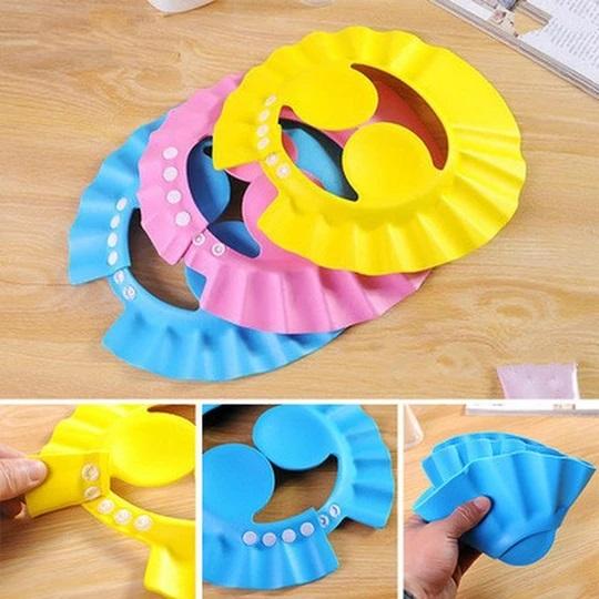 Verstellbare Schutzkappe für Babyduschen